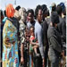 on looking migrant mother and infant in migrant processing centre